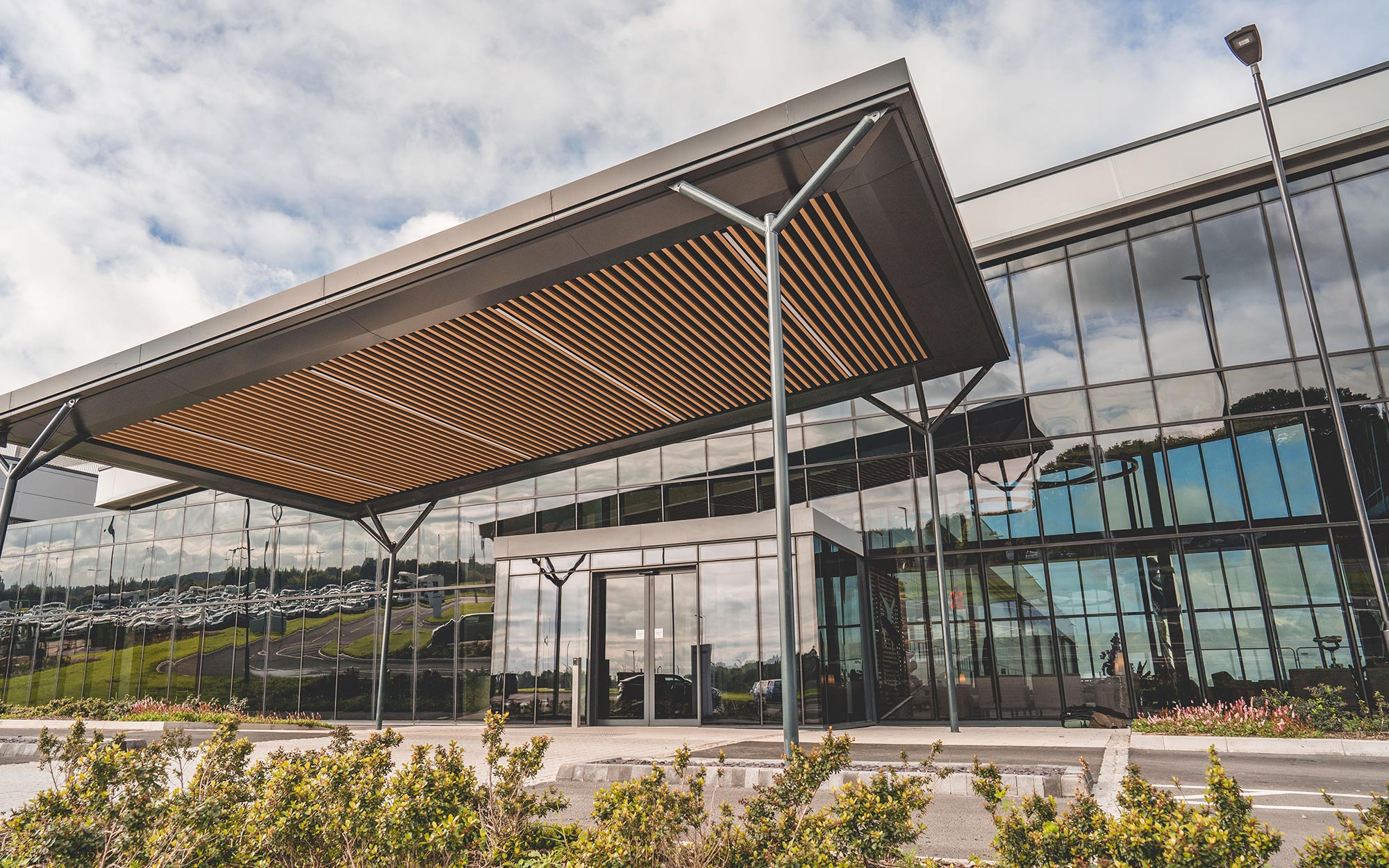 A solution for cladding refurbishment projects wood graineffect aluminium cladding on commercial building